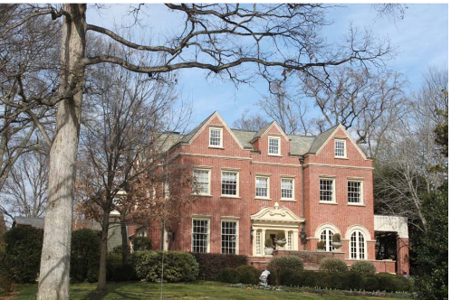 A large brick home that honestly looks like it would make good multi-family housing.